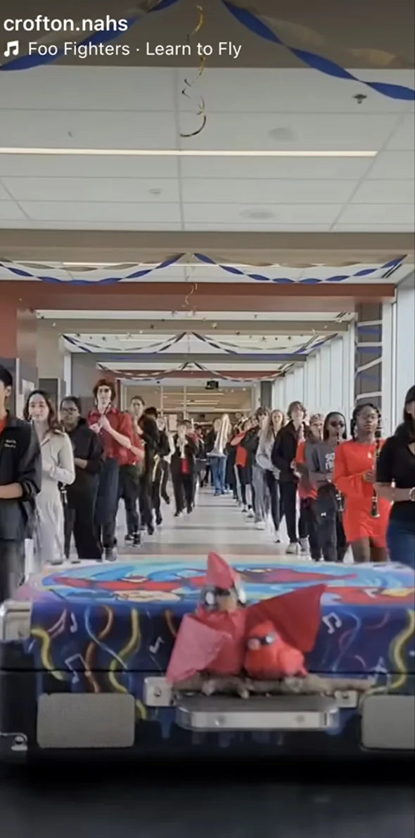 Crofton band marching in the hallway with their Cruiser
