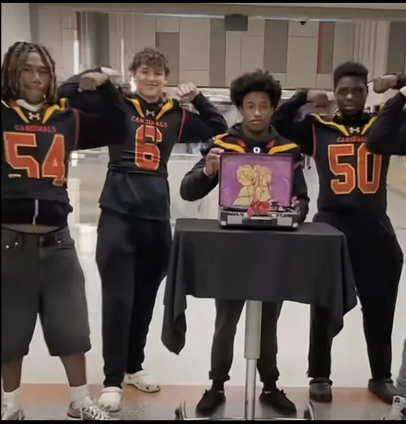 Football team celebrating their entry