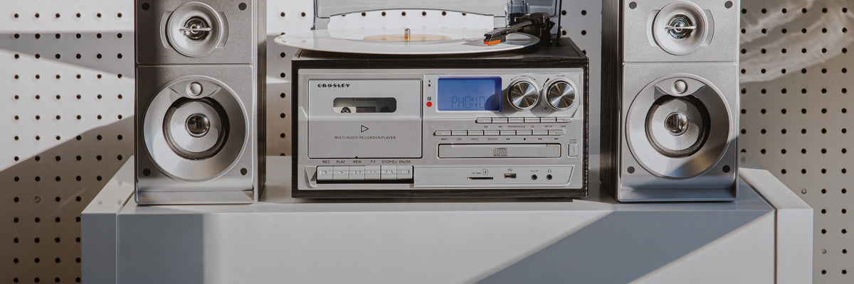 Crosley stereo system with turntable, cassette deck, CD player, and speakers