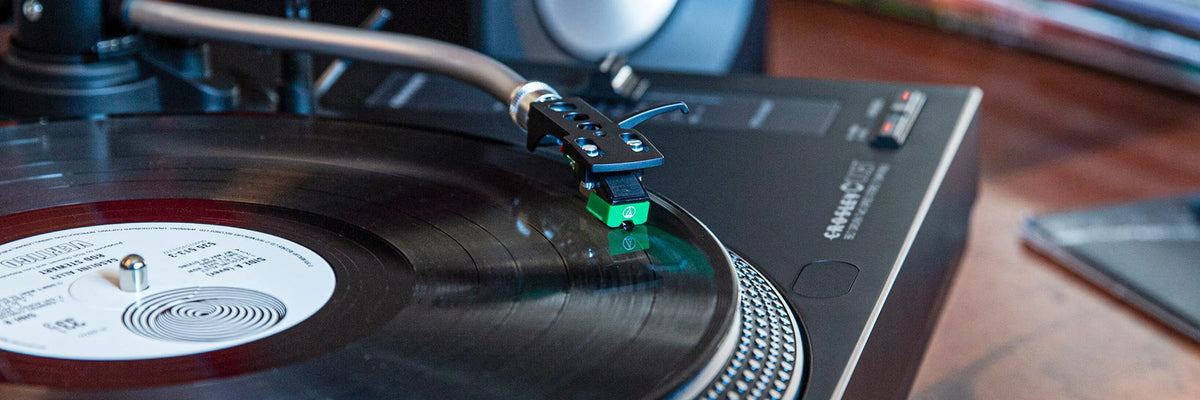 Close-up of a turntable stylus playing a vinyl record